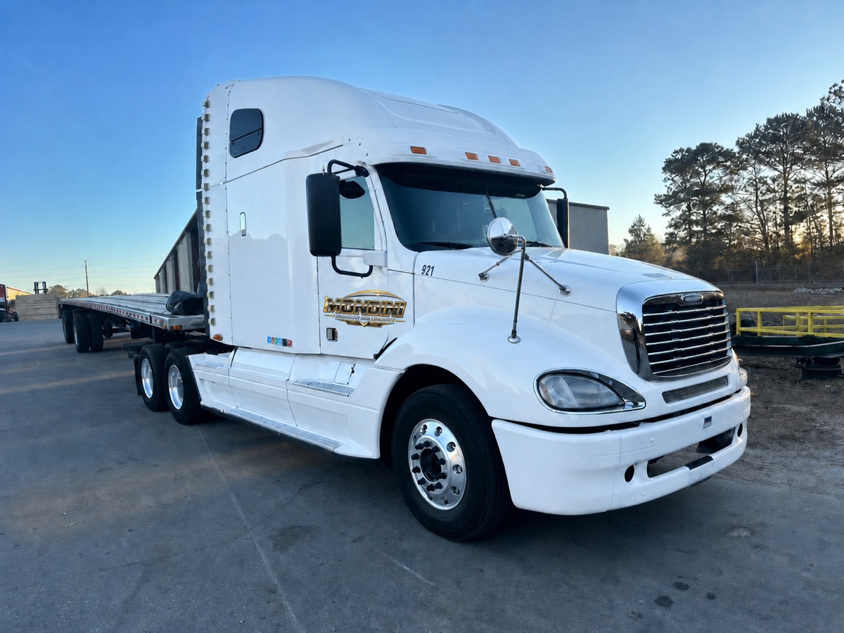 White Mondini Transport and Logistics flatbed truck with updated door branding